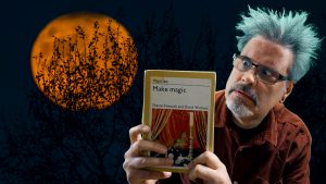 Nik Taylor with a magic book